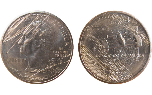 2002 State Quarter struck on a dime planchet next to a normal quarter showing the dramatic size difference